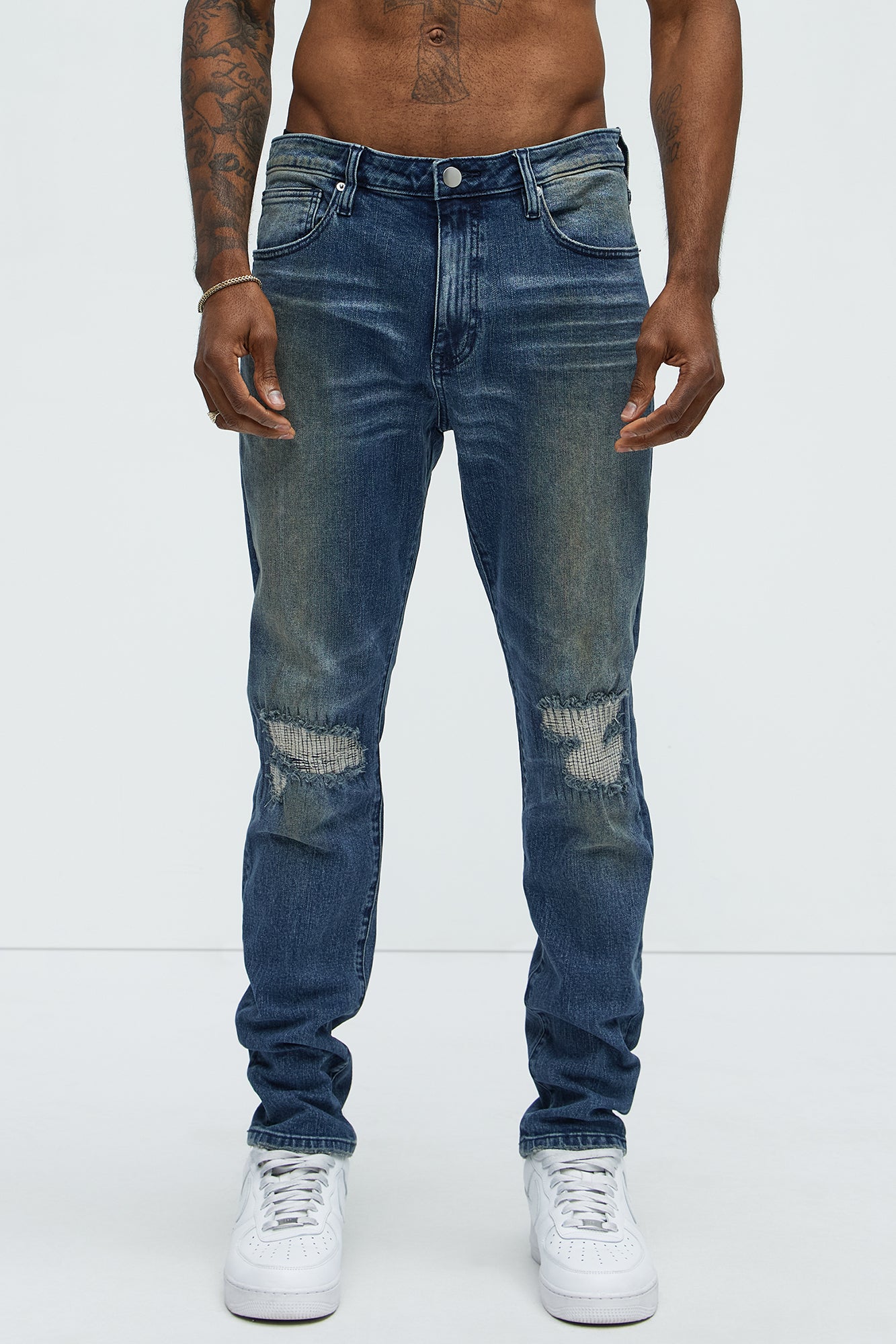 Faded In And Out Repaired Skinny Jeans